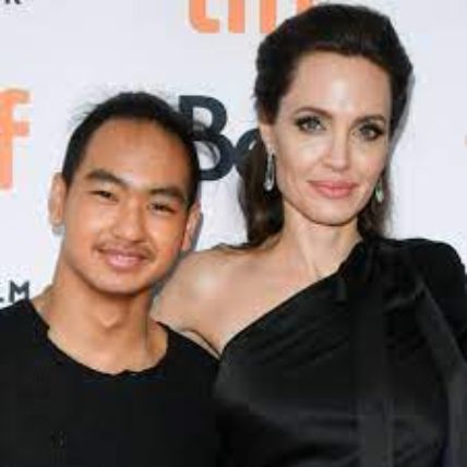 Maddox Jolie-Pitt with his mom